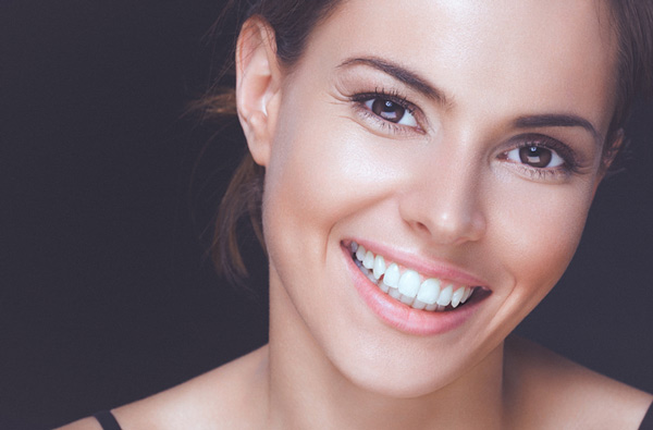Woman smiling with perfect teeth in New York, NY