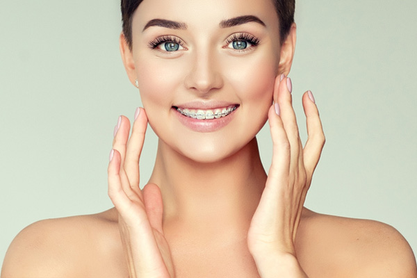 Woman smiling with braces and a perfect smile in New York, NY